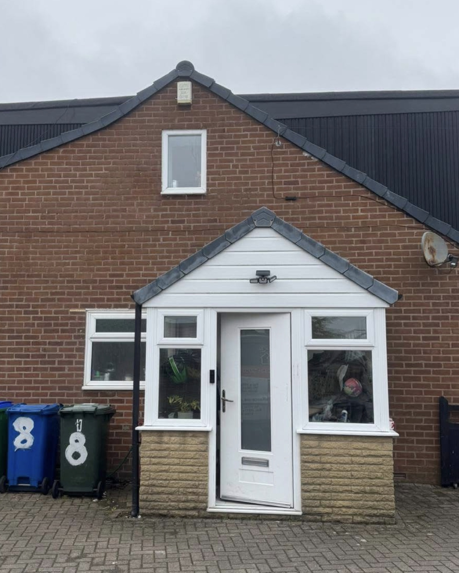 Brick and uPVC porch on a finished home