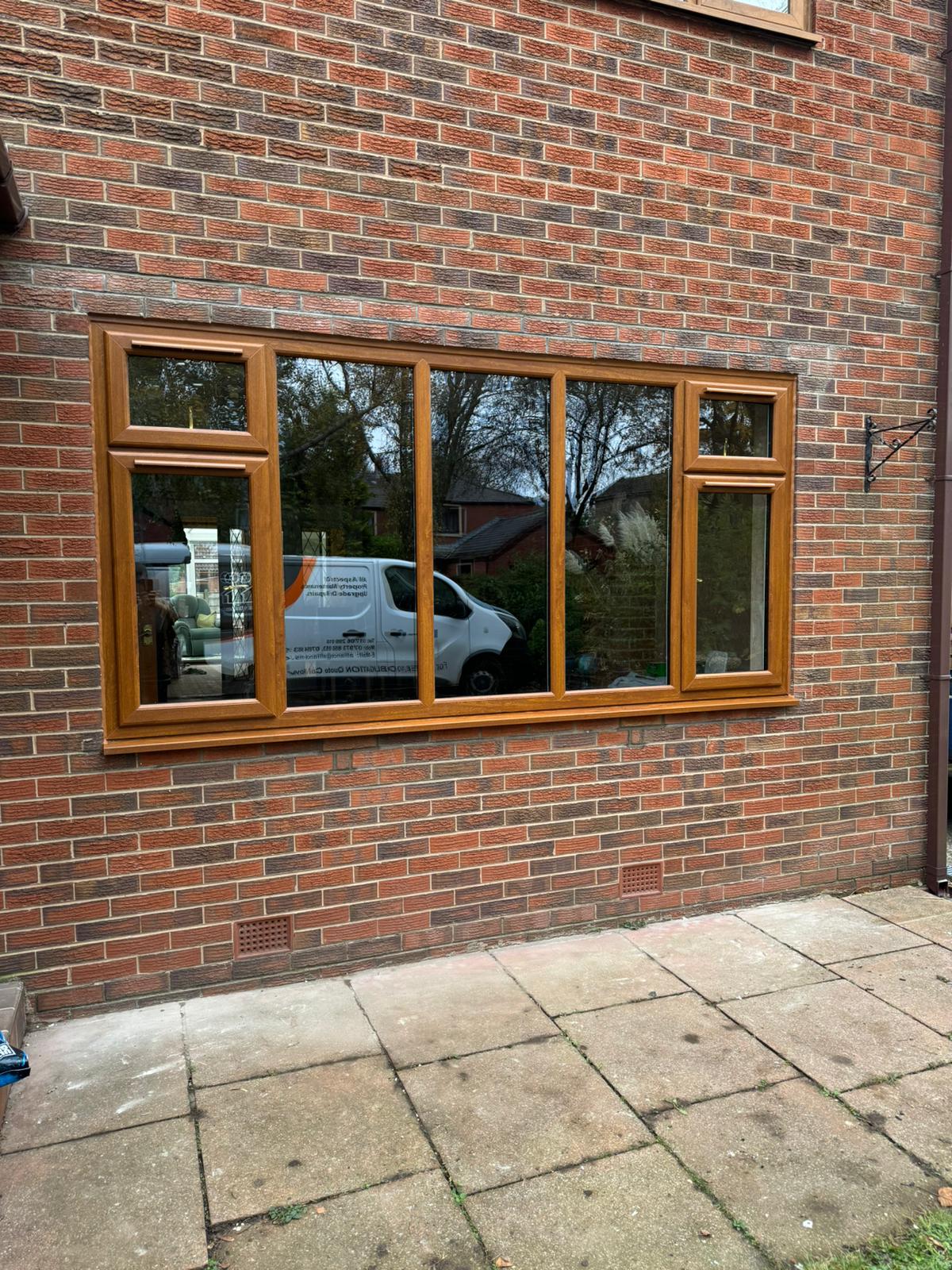 Oak-effect replacement window
